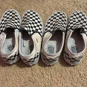 Two pairs of checkered slip-on vans.